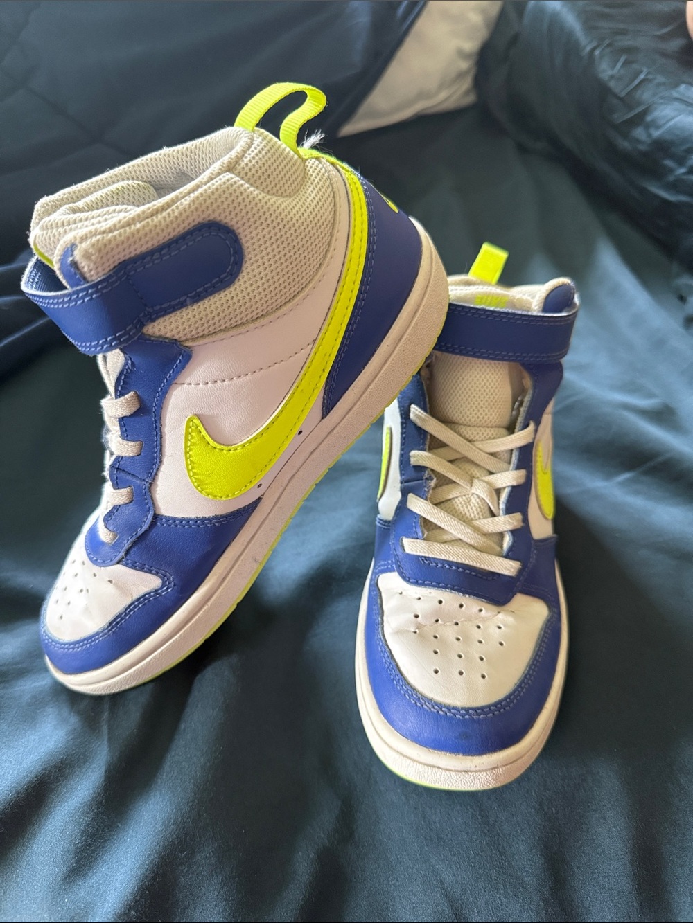 Blue and neon green Nike high tops